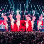 Mariah Carey performing on stage at Fridayz Live Melbourne 2025 with a vibrant crowd at Marvel Stadium.