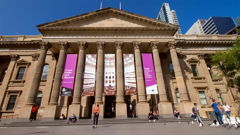 People browsing books and using digital services at Melbourne Library