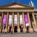 People browsing books and using digital services at Melbourne Library