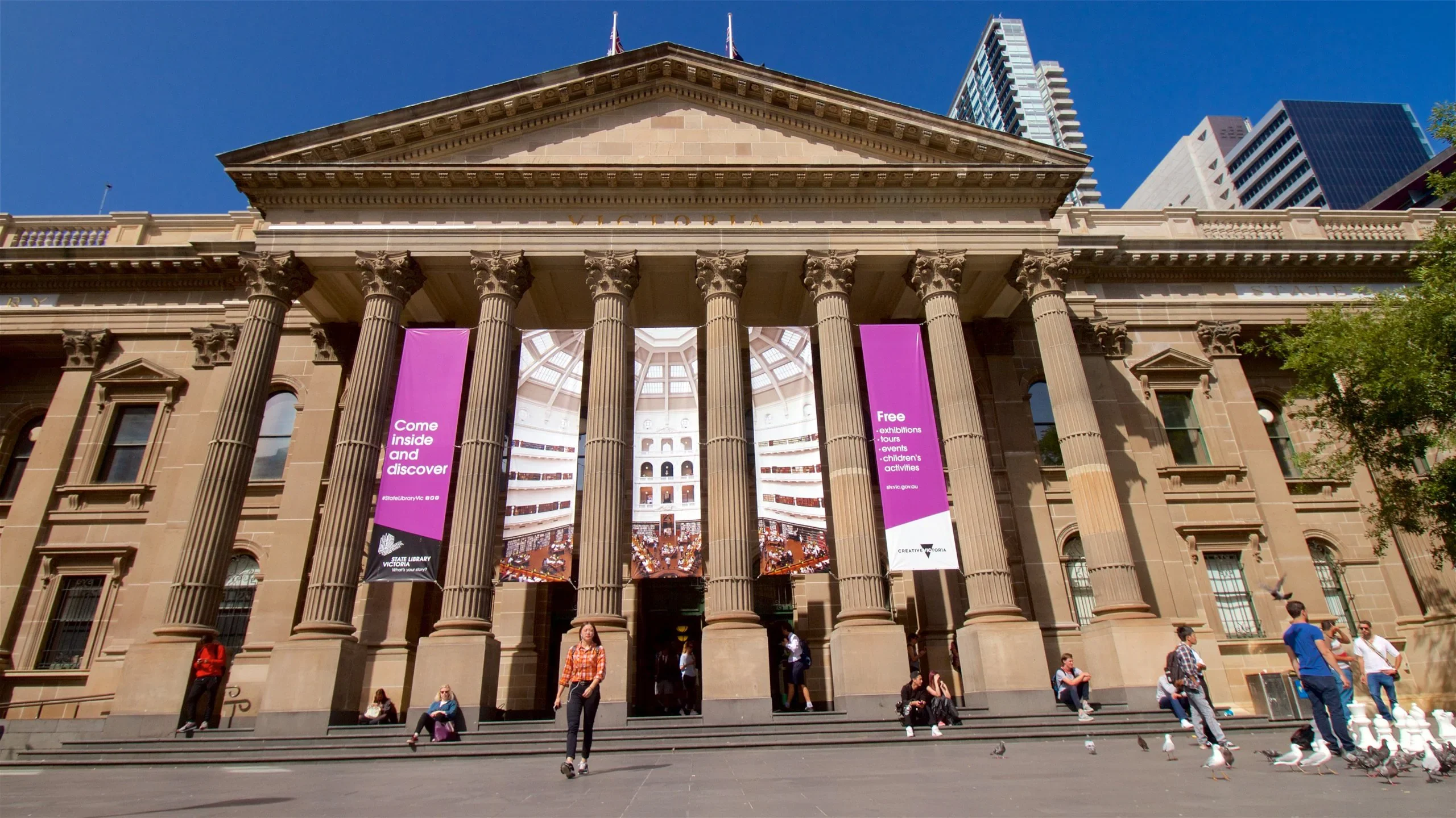 People browsing books and using digital services at Melbourne Library