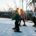 Family enjoying a snow adventure at Lake Mountain near Melbourne