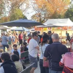 Visitors enjoying breakfast at Creswick Market food stalls