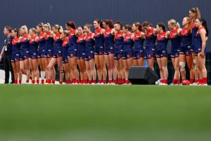 Fans celebrating at the AFLW Grand Final 2025 in Melbourne, showcasing the energy and excitement of the championship match.