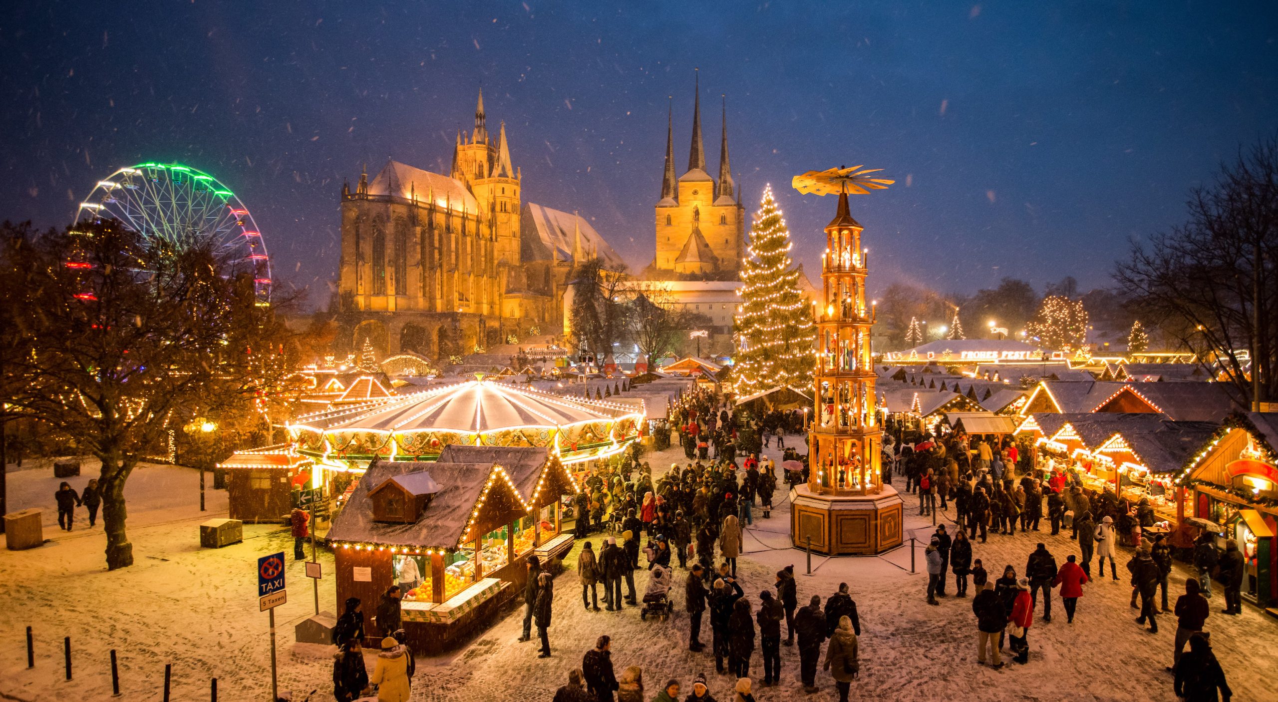 Families enjoying food, lights and festive stalls at the German Christmas Market 2025 in Melbourne